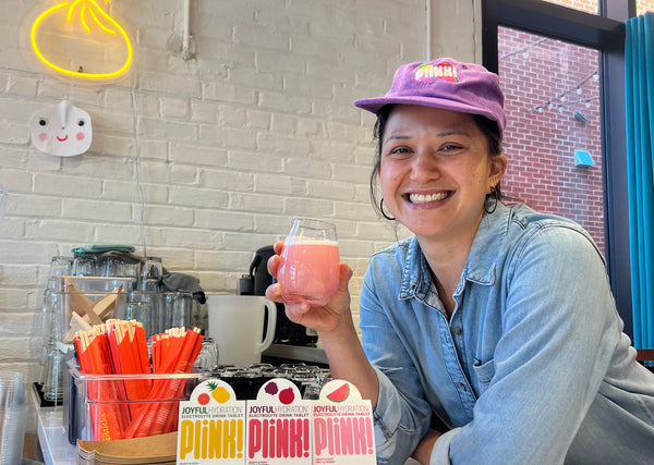 Alyssa wears the fruity cord cap at Mei Mei Dumplings. 
